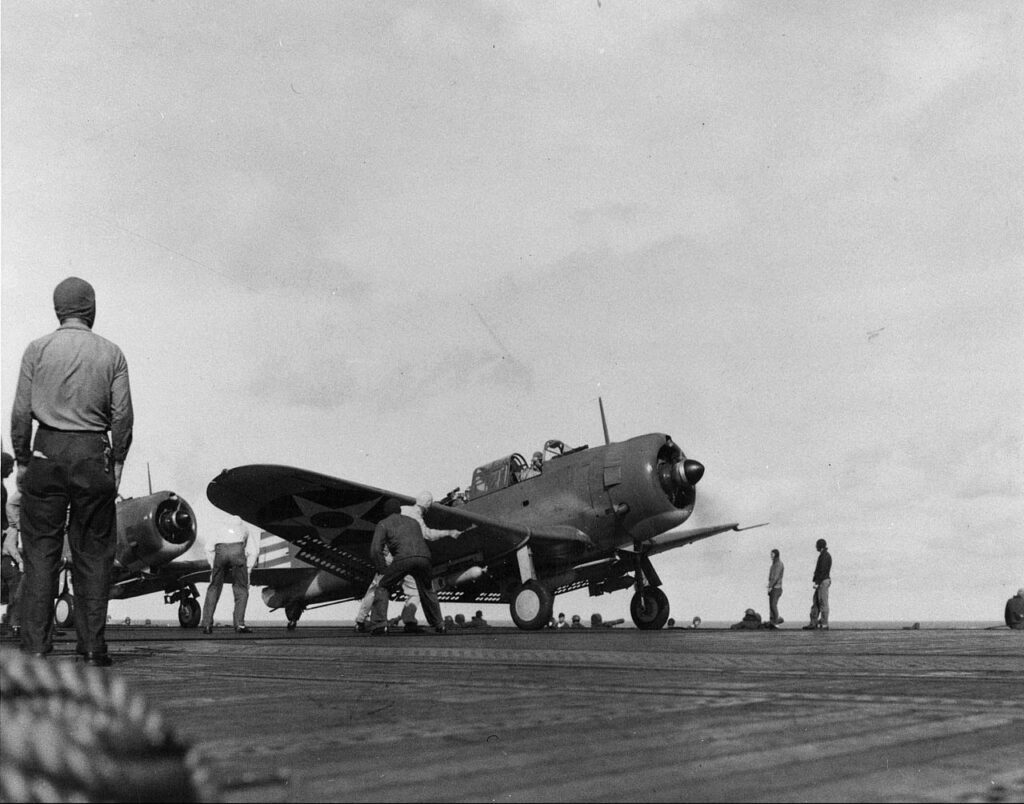 A bomb-laden SBD-2 Dauntless dive bomber prepares to take off from the U.S. carrier Enterprise during the raids on February 1.
